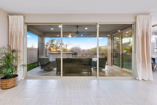 7106 W Foothills Acacia Pl, Marana, AZ 85658 - doorway with ceiling fan and a wall of windows