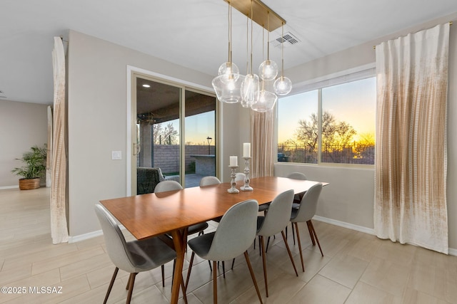 7106 W Foothills Acacia Pl, Marana, AZ 85658 - dining area featuring baseboards and a chandelier