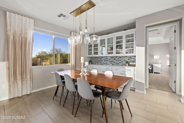 7106 W Foothills Acacia Pl, Marana, AZ 85658 - dining space featuring a chandelier and baseboards