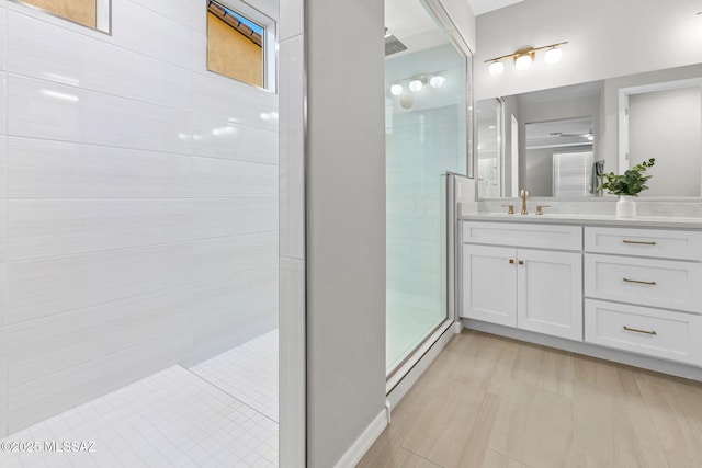 7106 W Foothills Acacia Pl, Marana, AZ 85658 - bathroom with vanity, tiled shower, and a baseboard heating unit