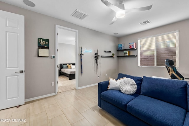 7106 W Foothills Acacia Pl, Marana, AZ 85658 - living area with ceiling fan and baseboards