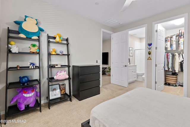 7106 W Foothills Acacia Pl, Marana, AZ 85658 - bedroom featuring carpet, connected bathroom, a walk in closet, and baseboards