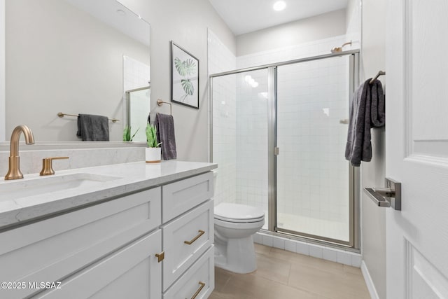 7106 W Foothills Acacia Pl, Marana, AZ 85658 - bathroom with vanity, toilet, a stall shower, and tile patterned flooring