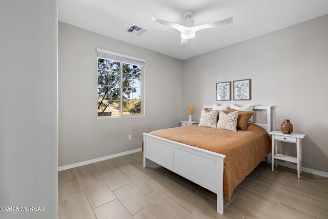 7106 W Foothills Acacia Pl, Marana, AZ 85658 - bedroom with baseboards, wood tiled floors, and ceiling fan