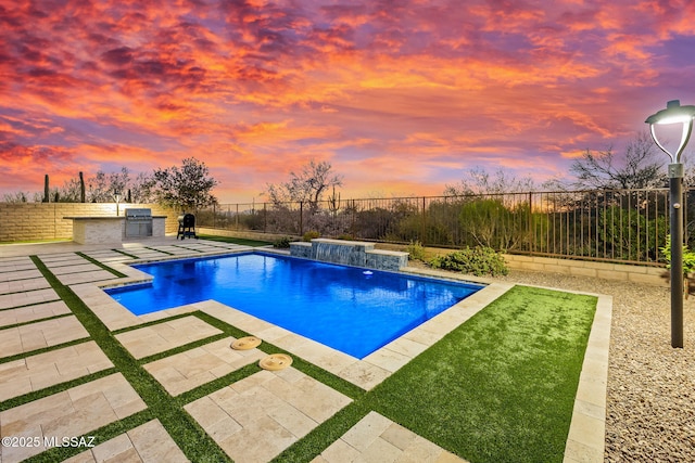 7106 W Foothills Acacia Pl, Marana, AZ 85658 - view of pool with exterior kitchen, a patio area, and a fenced backyard