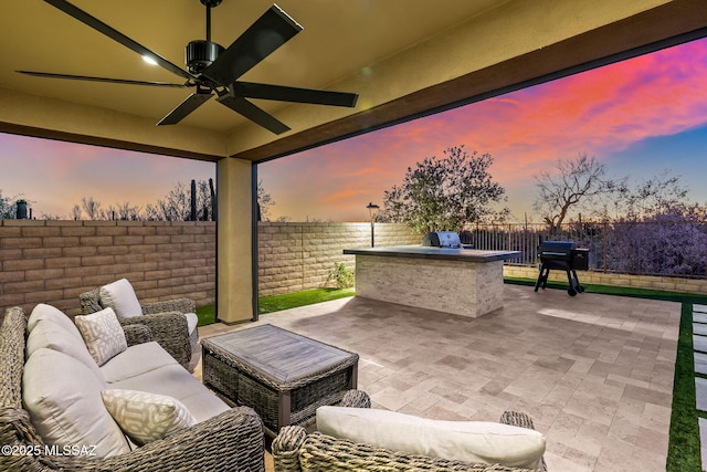 7106 W Foothills Acacia Pl, Marana, AZ 85658 - fenced backyard with a patio, ceiling fan, and an outdoor hangout area