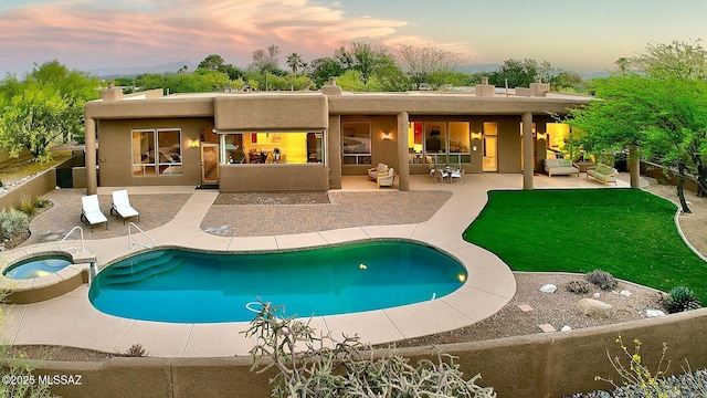 5269 N Pontatoc Rd, Tucson, AZ 85718 - back of house with a patio area, a fenced backyard, an outdoor hangout area, stucco siding, and a pool with connected hot tub