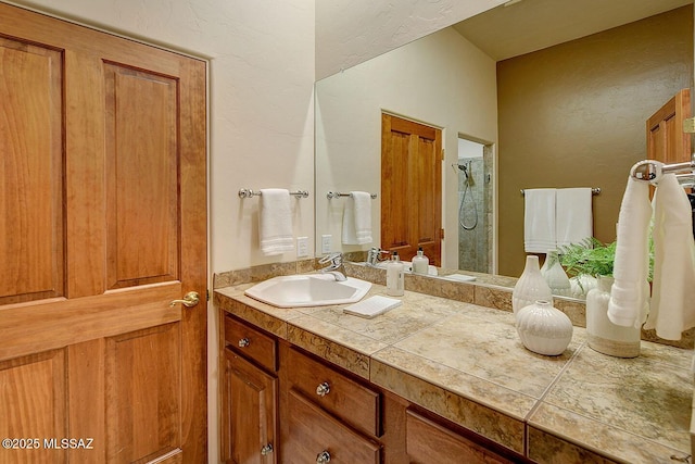 5269 N Pontatoc Rd, Tucson, AZ 85718 - full bath featuring a stall shower, vanity, and a textured wall