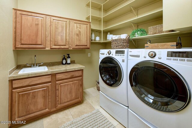 5269 N Pontatoc Rd, Tucson, AZ 85718 - clothes washing area with independent washer and dryer, cabinet space, and light tile patterned floors