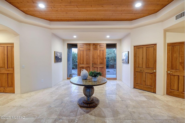 5269 N Pontatoc Rd, Tucson, AZ 85718 - entrance foyer with wooden ceiling, a tray ceiling, arched walkways, and recessed lighting