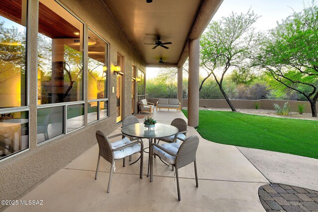 5269 N Pontatoc Rd, Tucson, AZ 85718 - view of patio / terrace featuring ceiling fan, fence, and outdoor dining area