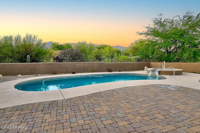 5269 N Pontatoc Rd, Tucson, AZ 85718 - pool at dusk featuring a patio area and a fenced backyard