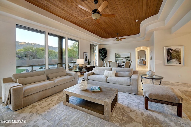 5269 N Pontatoc Rd, Tucson, AZ 85718 - living area featuring wooden ceiling, ceiling fan, arched walkways, and a mountain view