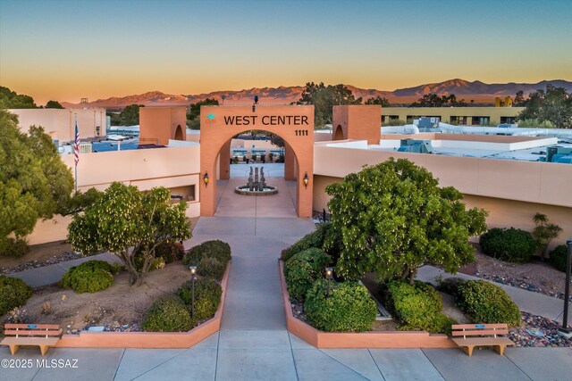 1018 Cll De La Temporada, Green Valley, AZ 85614 - property at dusk featuring a mountain view
