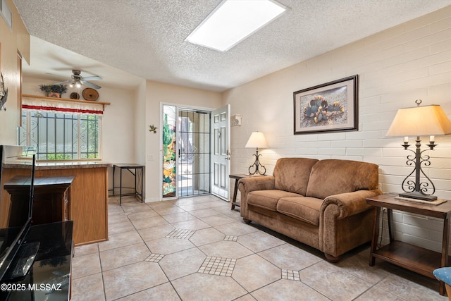 1018 Cll De La Temporada, Green Valley, AZ 85614 - living area with a textured ceiling, ceiling fan, and light tile patterned floors