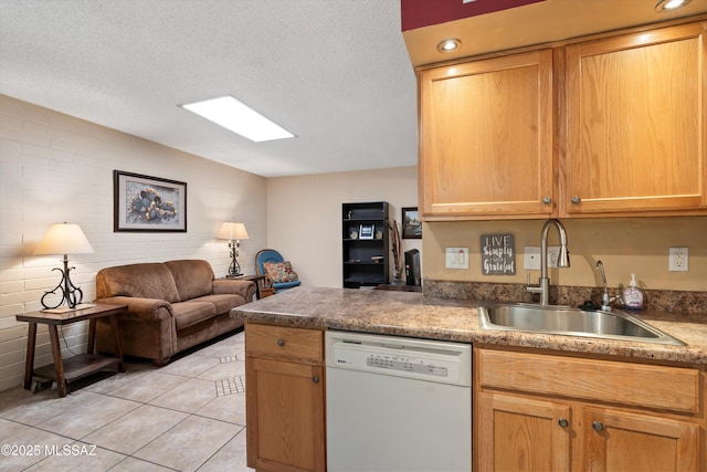 1018 Cll De La Temporada, Green Valley, AZ 85614 - kitchen featuring white dishwasher, a sink, open floor plan, light tile patterned floors, and a peninsula
