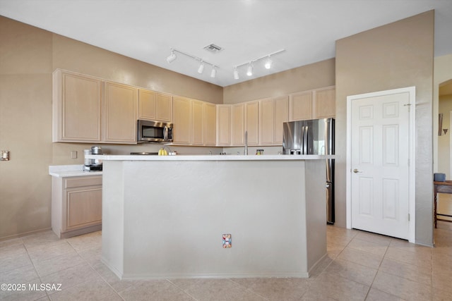 182 N Desert Park Pl, Tucson, AZ 85745 - kitchen with stainless steel appliances, light brown cabinets, light countertops, light tile patterned floors, and a center island
