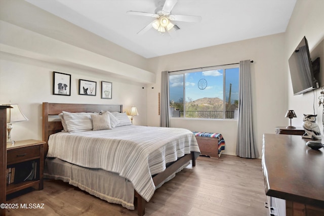 182 N Desert Park Pl, Tucson, AZ 85745 - bedroom featuring wood finished floors, a ceiling fan, and baseboards