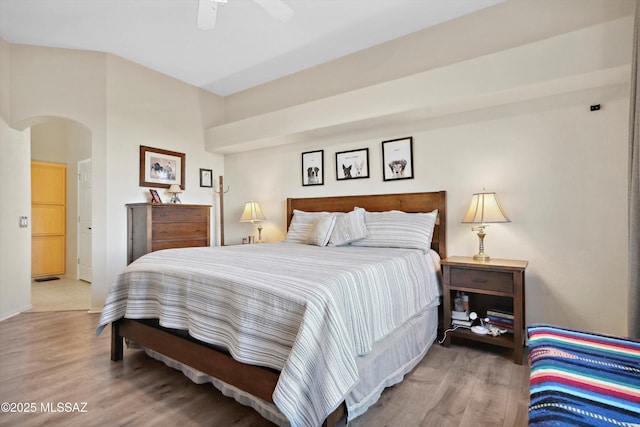 182 N Desert Park Pl, Tucson, AZ 85745 - bedroom with wood finished floors, arched walkways, ceiling fan, and baseboards