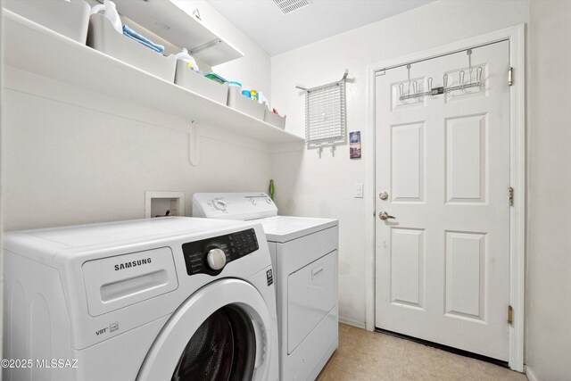182 N Desert Park Pl, Tucson, AZ 85745 - laundry area with independent washer and dryer, light tile patterned floors, and baseboards
