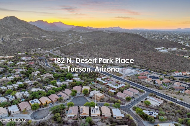 182 N Desert Park Pl, Tucson, AZ 85745 - aerial view at dusk of a mountain view and a residential view