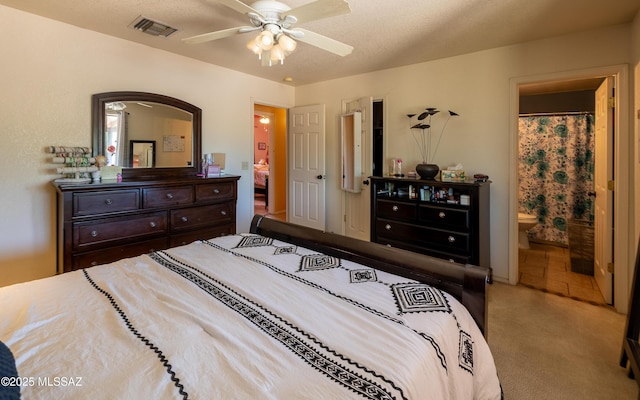 253 Grillo Ct, Rio Rico, AZ 85648 - carpeted bedroom with ensuite bath and ceiling fan