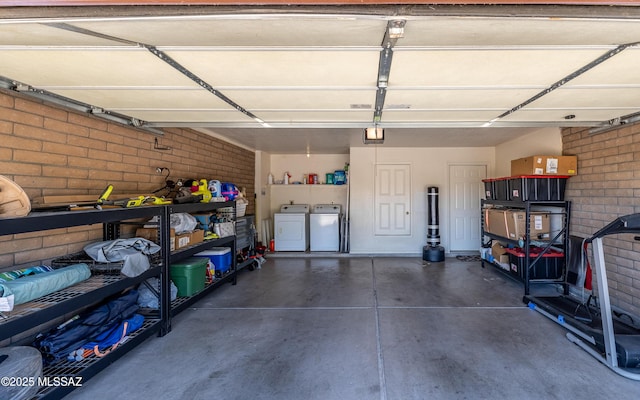 253 Grillo Ct, Rio Rico, AZ 85648 - garage featuring separate washer and dryer and a garage door opener