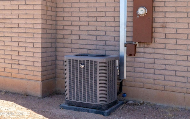 253 Grillo Ct, Rio Rico, AZ 85648 - exterior view of central AC, brick siding, and electric meter