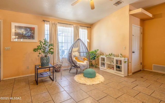 253 Grillo Ct, Rio Rico, AZ 85648 - living area with ceiling fan, light tile patterned floors, and baseboards