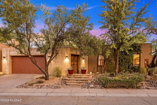 3008 E Placita Santa Lucia, Tucson, AZ 85716 - view of front facade featuring a garage and driveway