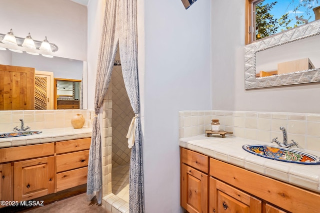 3008 E Placita Santa Lucia, Tucson, AZ 85716 - full bathroom featuring backsplash, vanity, and a tile shower