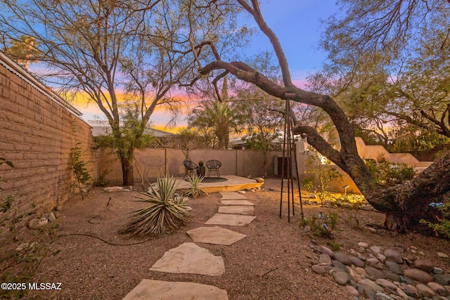 3008 E Placita Santa Lucia, Tucson, AZ 85716 - fenced backyard with a patio area