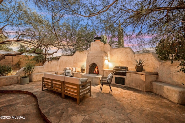 3008 E Placita Santa Lucia, Tucson, AZ 85716 - view of patio with area for grilling and an outdoor living space with a fireplace
