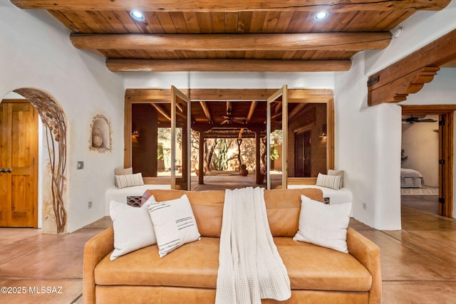3008 E Placita Santa Lucia, Tucson, AZ 85716 - living area with a wooden ceiling with exposed beams, a ceiling fan, arched walkways, finished concrete flooring, and recessed lighting
