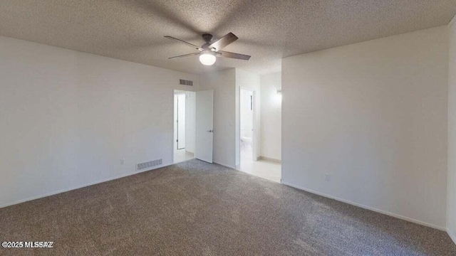 unfurnished room featuring a ceiling fan, carpet flooring, and a textured ceiling