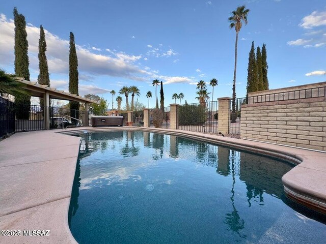 view of pool with fence