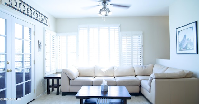 6655 N Canyon Crest Dr N Unit 27201, Tucson, AZ 85750 - living room featuring a ceiling fan, plenty of natural light, light colored carpet, and baseboards