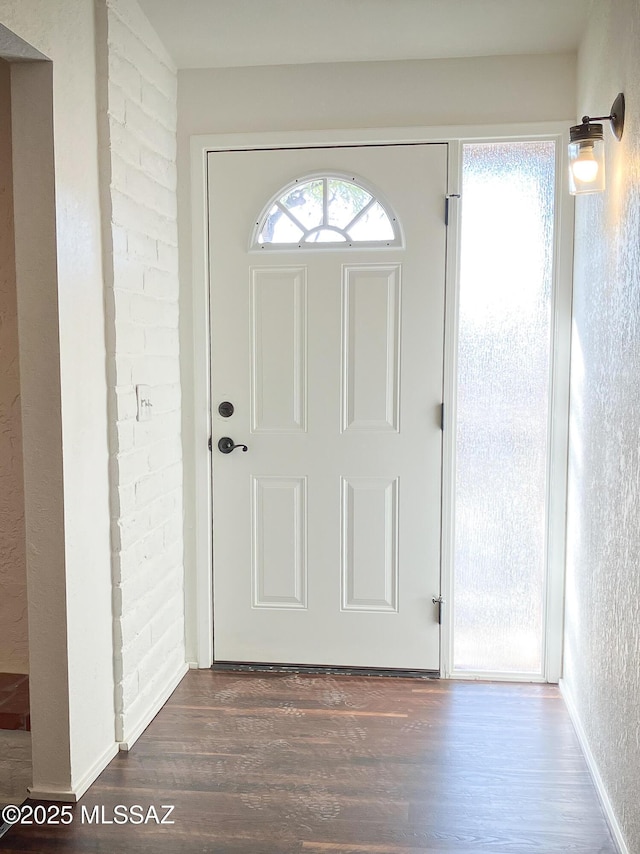 3700 S Serena Ln, Tucson, AZ 85730 - entryway with dark wood-style flooring and baseboards
