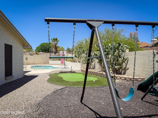 3700 S Serena Ln, Tucson, AZ 85730 - view of jungle gym with a putting area, a patio, and a fenced backyard