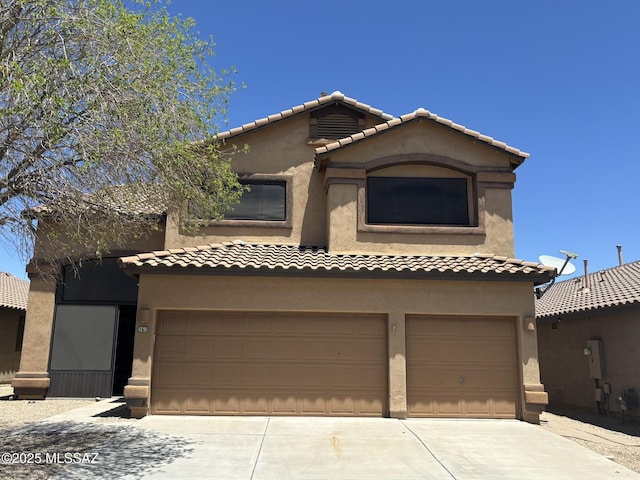 262 W Calle Paso Suave, Sahuarita, AZ 85629 - mediterranean / spanish house featuring an attached garage, stucco siding, driveway, and a tiled roof