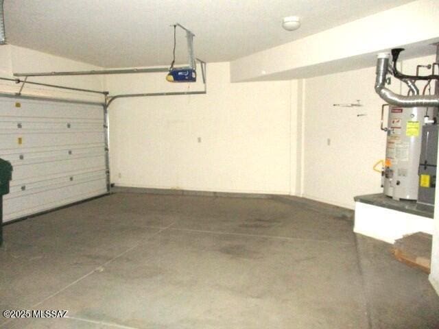 262 W Calle Paso Suave, Sahuarita, AZ 85629 - garage with gas water heater and a garage door opener