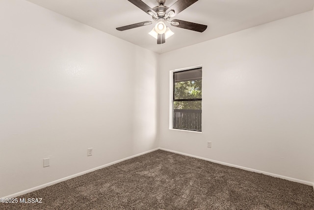 unfurnished room featuring dark colored carpet, ceiling fan, and baseboards