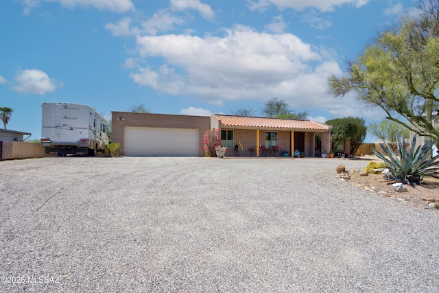 2282 W Rapallo Way, Tucson, AZ 85741 - view of front of house with a tile roof, a garage, driveway, and covered porch