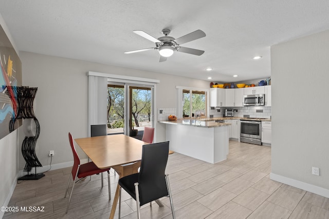 2282 W Rapallo Way, Tucson, AZ 85741 - dining room featuring ceiling fan, baseboards, recessed lighting, and wood finish floors