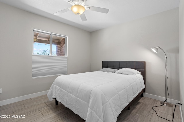 2282 W Rapallo Way, Tucson, AZ 85741 - bedroom featuring wood finish floors, baseboards, and a ceiling fan