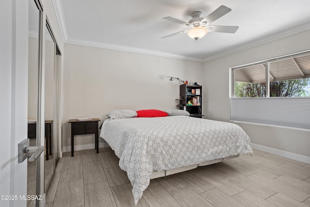 2282 W Rapallo Way, Tucson, AZ 85741 - bedroom with wood finish floors, baseboards, ornamental molding, a closet, and a ceiling fan