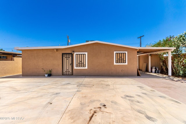 view of front of house featuring stucco siding