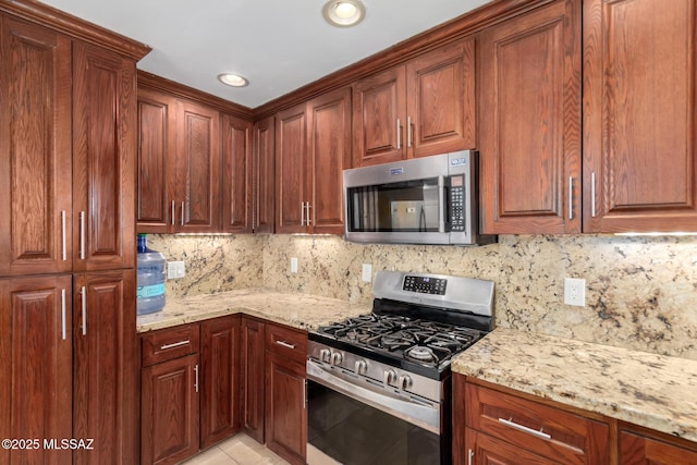kitchen with appliances with stainless steel finishes, decorative backsplash, light stone countertops, recessed lighting, and light tile patterned floors
