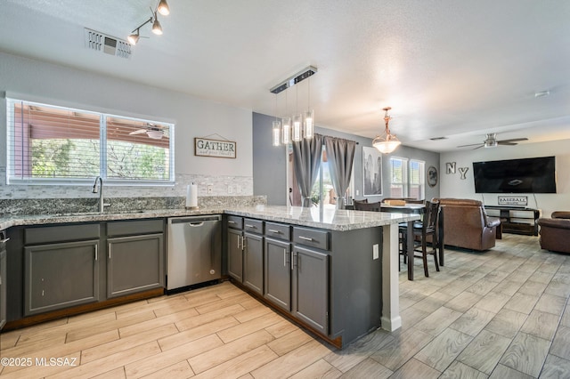 14570 S Sumac Dr, Sahuarita, AZ 85629 - kitchen featuring dishwasher, ceiling fan, a sink, and a peninsula