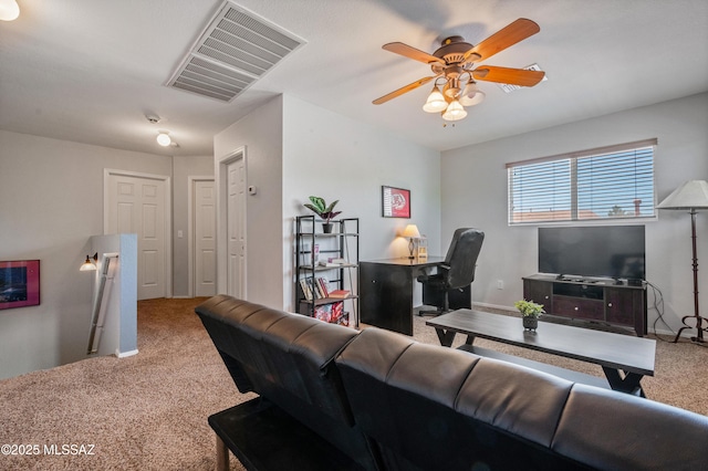 14570 S Sumac Dr, Sahuarita, AZ 85629 - carpeted living room with ceiling fan and a desk